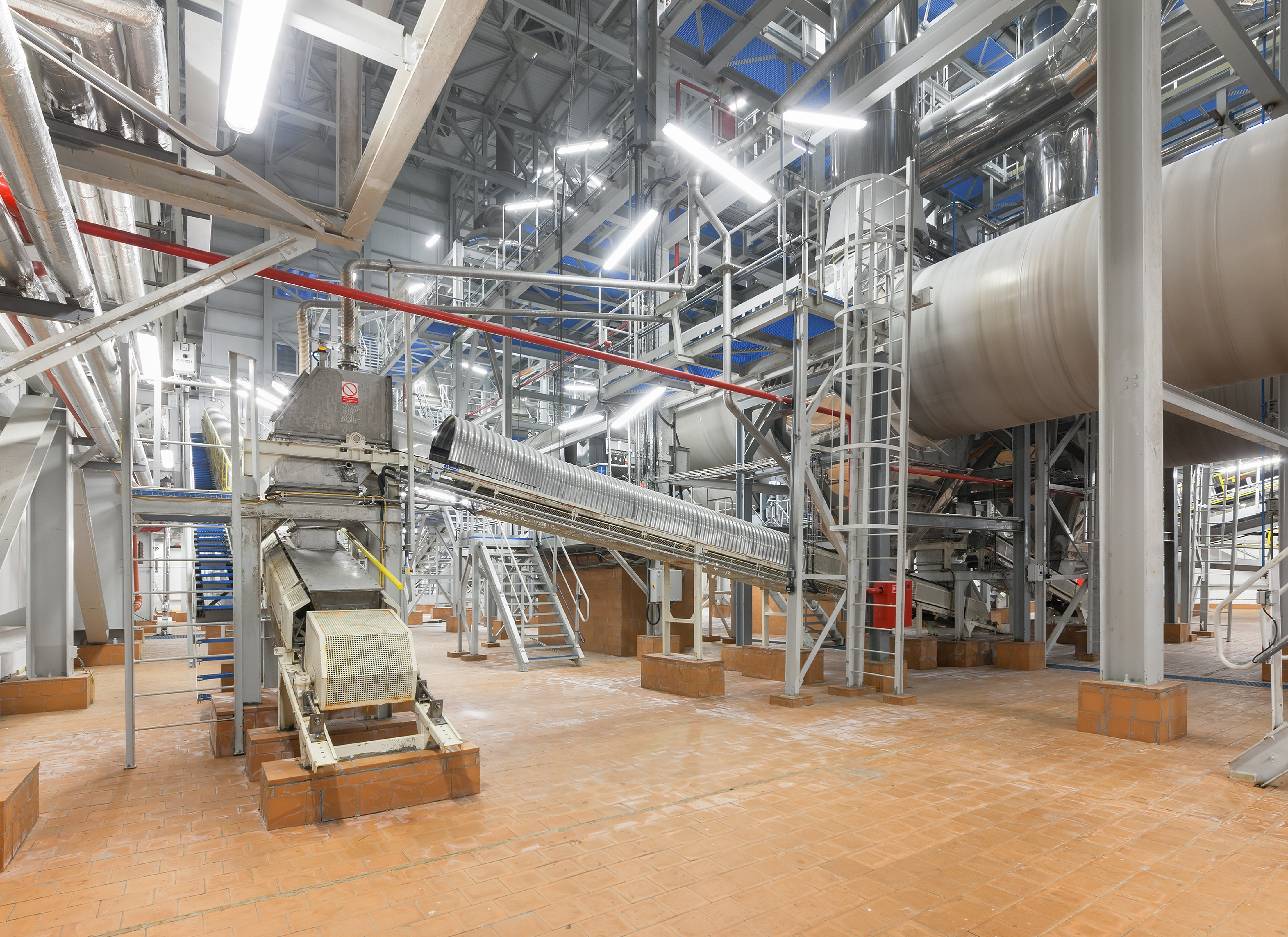 The conveyor system and the drum mould at the plant for the production of ammonium nitrate. Fertilizer manufacturing plant.