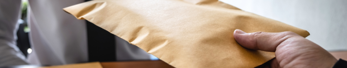 Businessman receive bribe money in envelope, bribery and corruption concept.